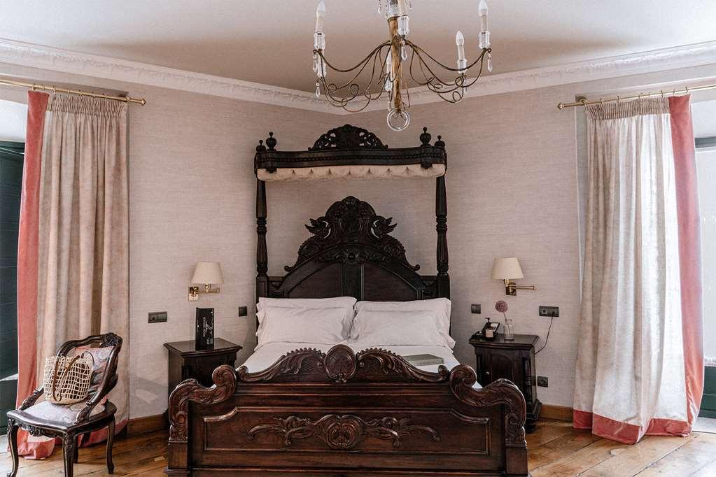 Palacio De Aviles Affiliated By Melia Camera foto A bedroom at the hotel